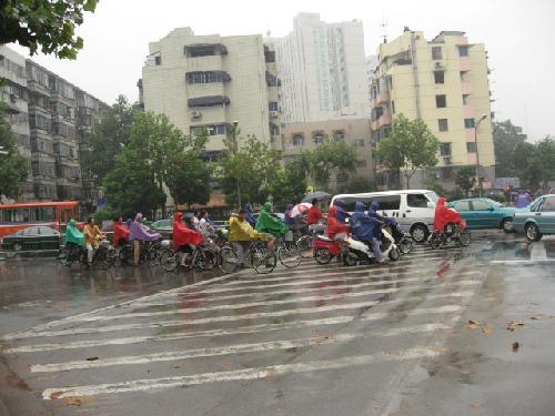 Chinese people wearing colorful rain coat